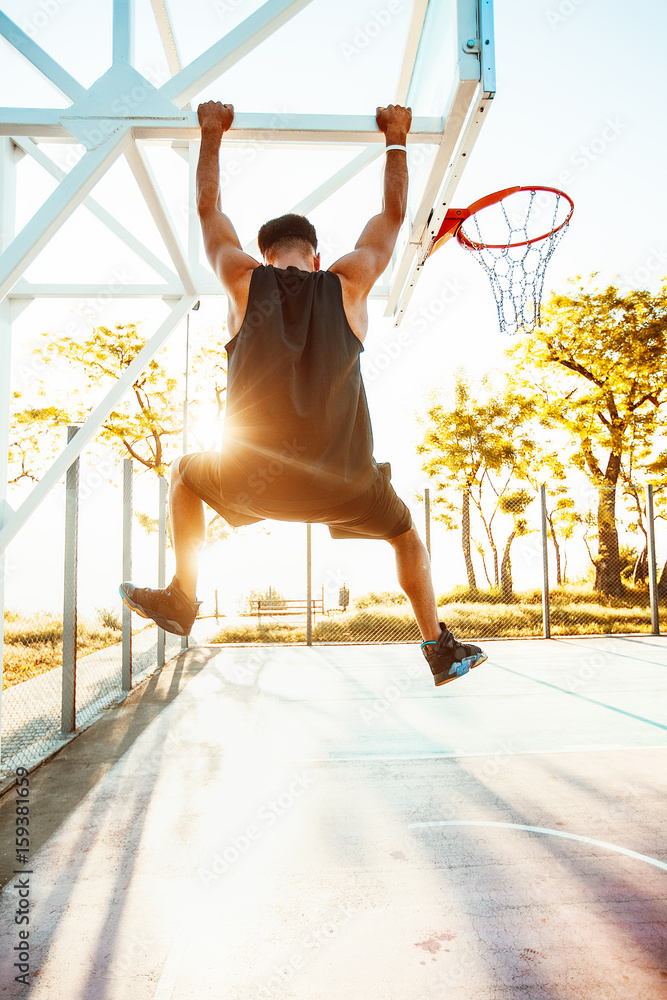Ambitiøs Begyndelsen lejer Basketball player hangs on the rim.attractive,laugh,sport games,street  ball,black,sport outfit,casual wear,black clothes Stock Photo | Adobe Stock