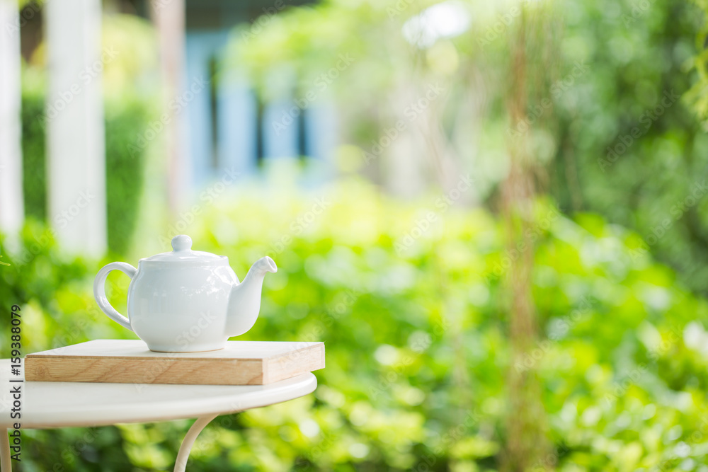 teapot on a blurred background of nature teapot on a blurred background of nature