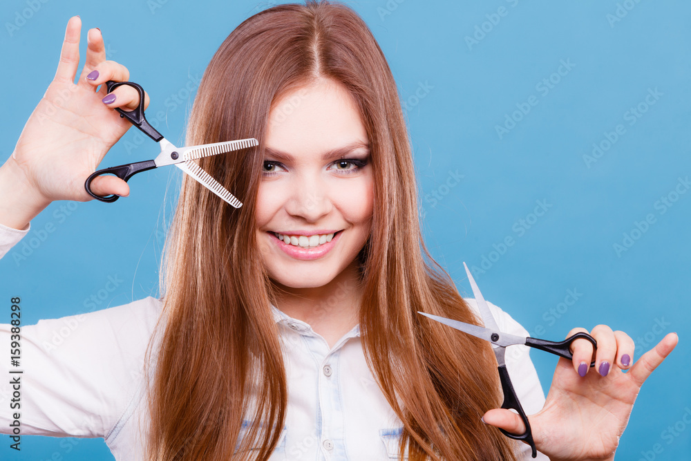 Crazy girl with scissors. Hairdresser in action. Stock Photo