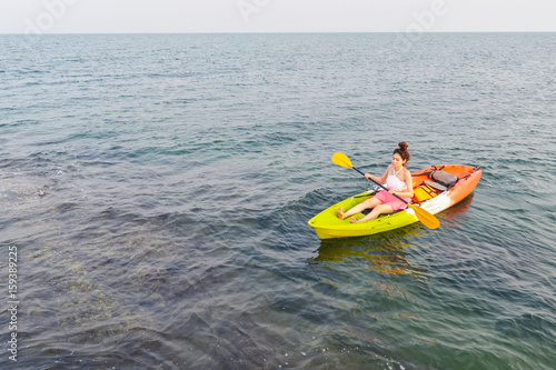 Women kayaking in the sea