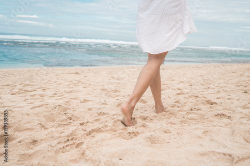 woman leg on the beach