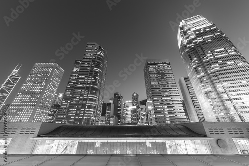 Modern office building and skyline of Hong Kong City at dusk