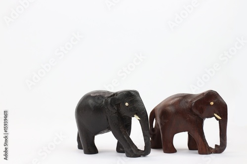 hand carved wooden elephants standing isolated on white background  © RenysView