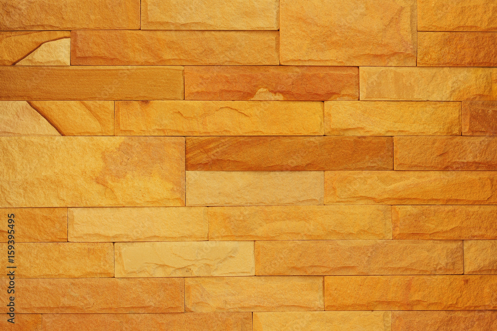 Fototapeta premium Pattern of rough sandstone wall texture for background and design.