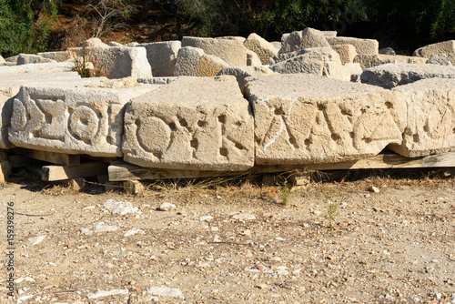 Stone with carved script in ancient Lycian city Patara. Turkey