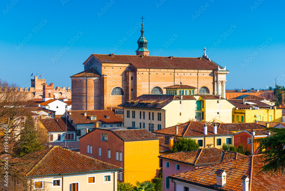 Old cathedral in the center of the walled city of Cittadella. Panorama of the small Italian town. Cityscape against the clear blue sky, Italy.