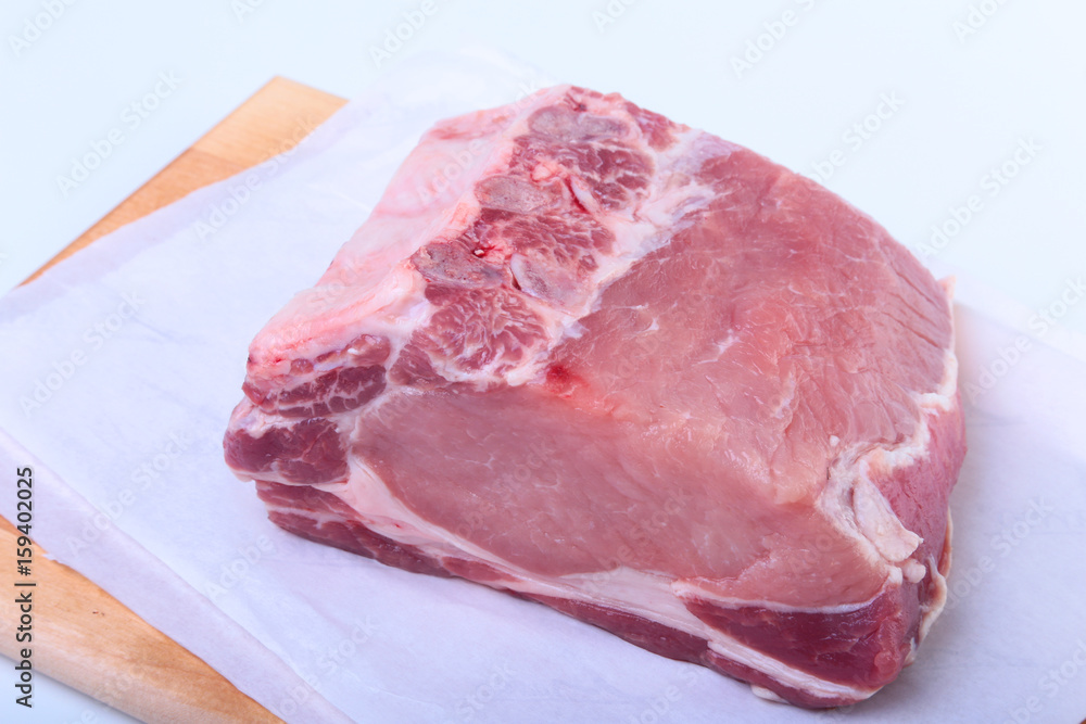 Raw pork chops with herbs and spices on cutting board. Ready for cooking. Raw pork chops with herbs and spices on cutting board. Ready for cooking.