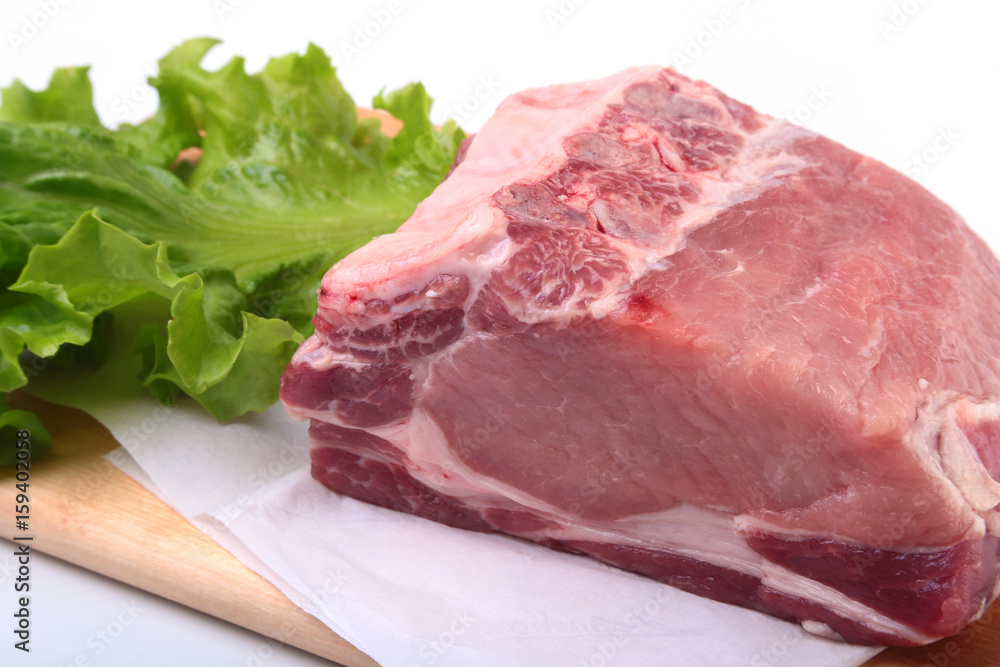 Raw pork chops with herbs and spices on cutting board. Ready for cooking. Raw pork chops with herbs and spices on cutting board. Ready for cooking.