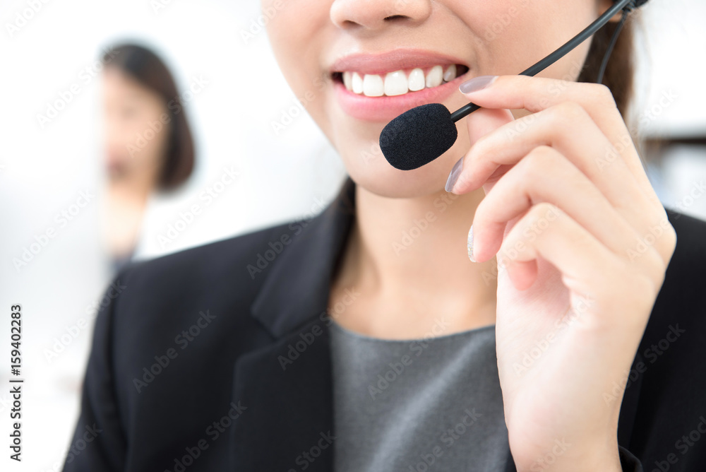 Woman with microphone headset as an operator in call center Woman with microphone headset as an operator in call center