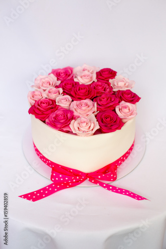 Pink marzipan roses on a cake