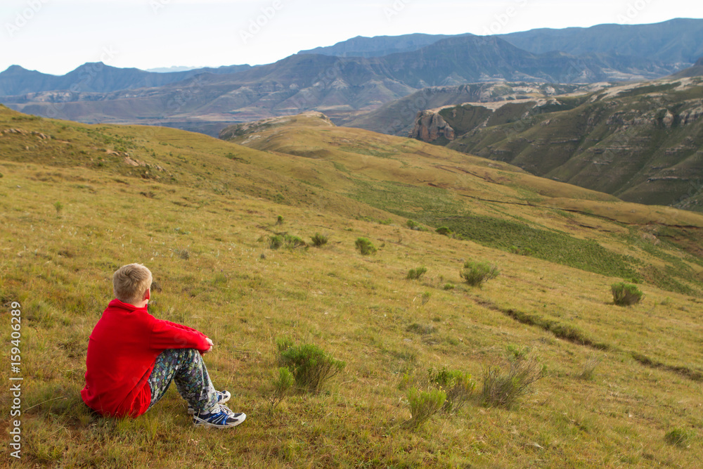 boy praising and enjoying mountains and landscape boy praising and enjoying mountains and landscape