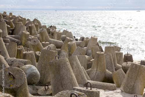 Concrete breakwaters piled on the seashore