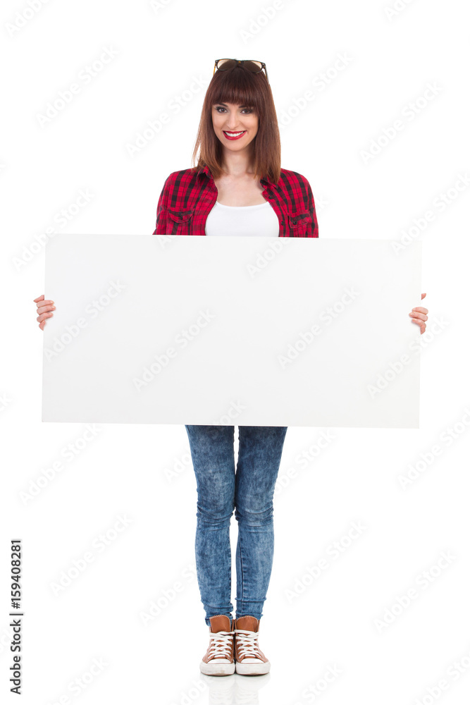 Casual Girl Is Posing With White Blank Poster Casual Girl Is Posing With White Blank Poster