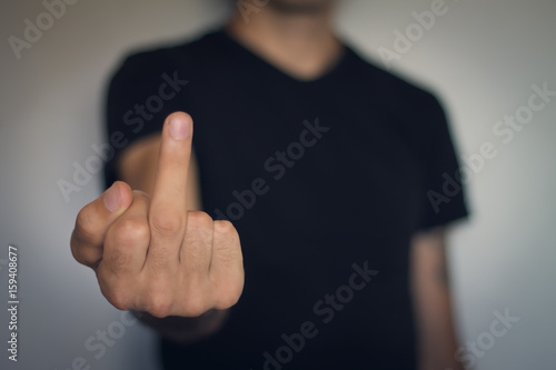 Man show fuck you sign.