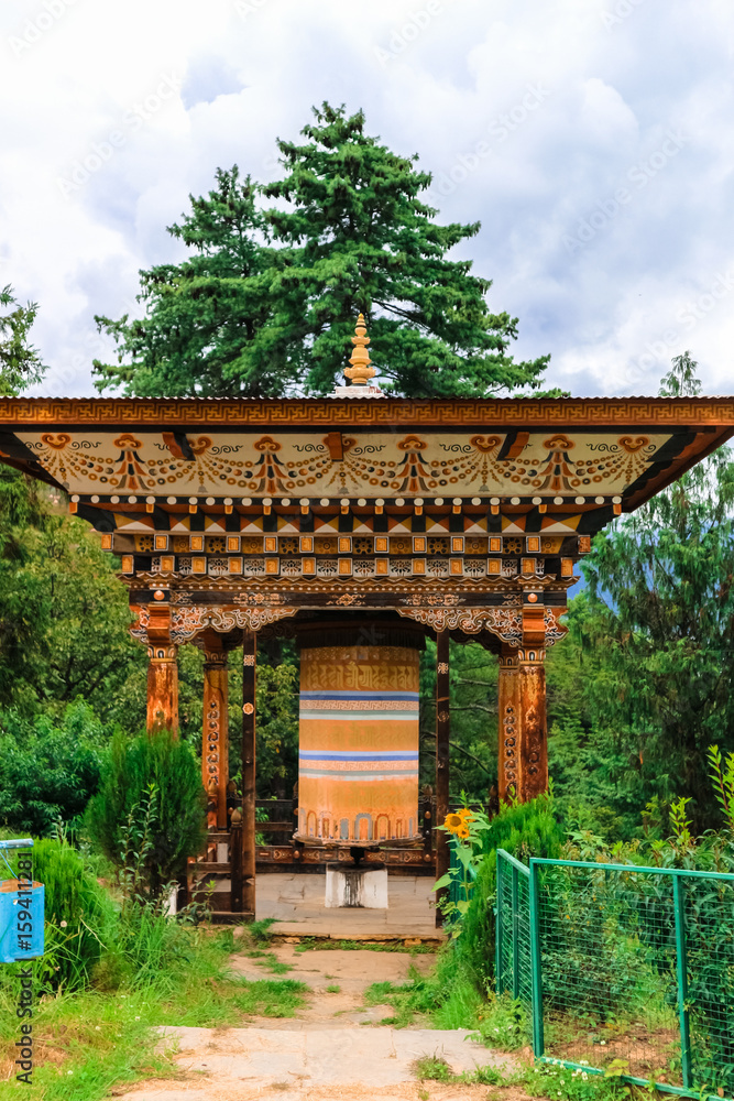 Buddhist prayer wheel in Wangdue Phodrang, Bhutan Buddhist prayer wheel in Wangdue Phodrang, Bhutan