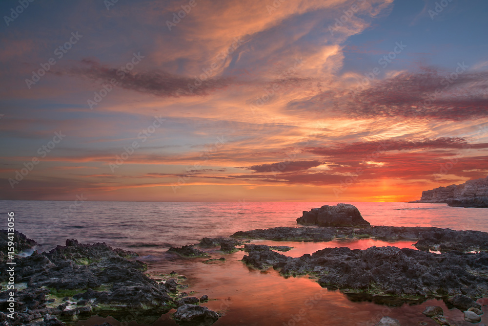 Sea sunset on the rocks