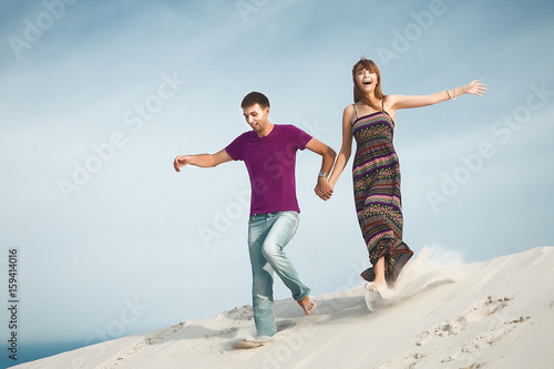 couple running from mountain