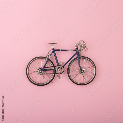 Fototapeta Naklejka Na Ścianę i Meble -  Sport concept - toy bicycles on pink background