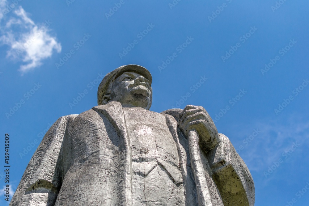 Kremenivka, Ukraine - May 21, 2017: The monument to Vladimir Lenin, the Soviet leader. Stone statue with a view to the sky. Bottom view.