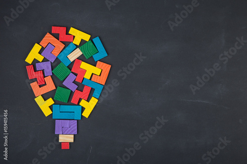 Business creative solution concept jigsaw on the blackboard photo