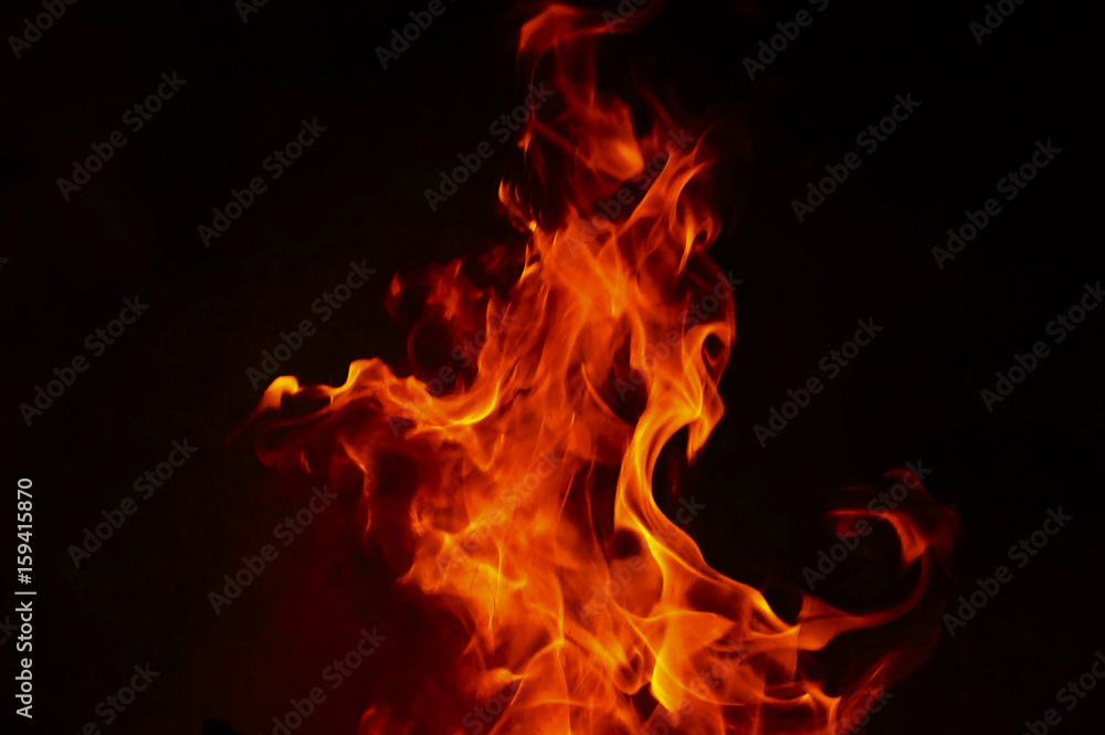 Fototapeta premium Fire Texture With Motion Blur Effect Over Black Background