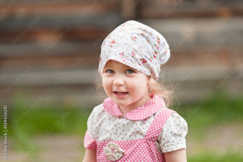 Portrait of pretty little girl in kerchief, summer Portrait of pretty little girl in kerchief, summer