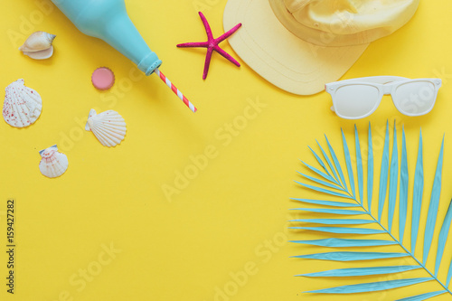 set for a beach sea holiday: cocktail or lemonade in the bottle, cap and sunglasses