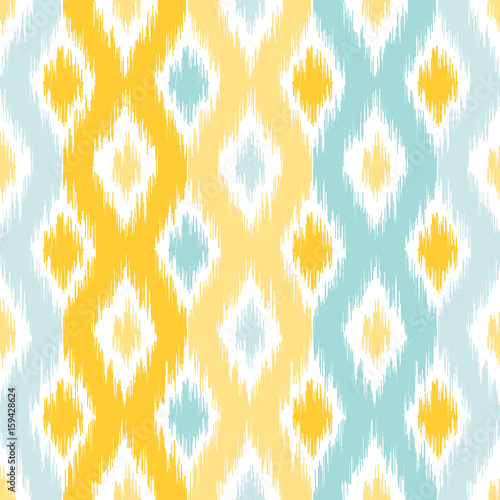 Seamless geometric pattern, based on ikat fabric style. Vector illustration. Carpet rug texture vector imitation. Yellow and turquoise mint ogee pattern.