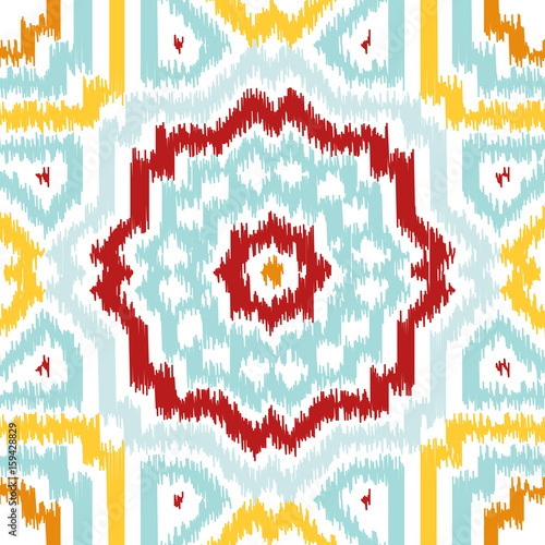 Seamless geometric pattern, based on ikat fabric style. Vector illustration. Carpet rug texture vector imitation. Colorful rug pattern in yellow, red, turquoise mint and white.