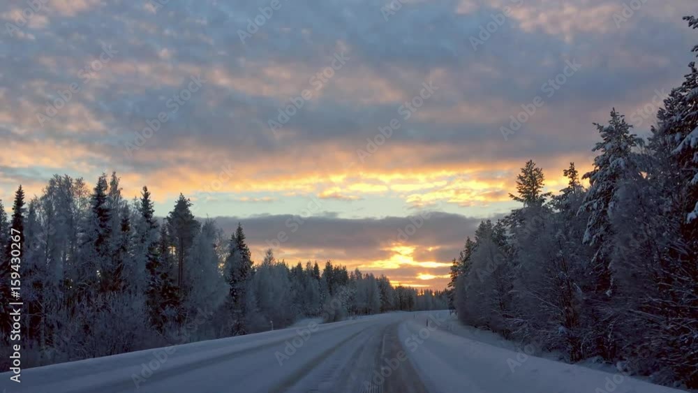 Driving a car in a beautiful snowy landscape Driving a car in a beautiful snowy landscape