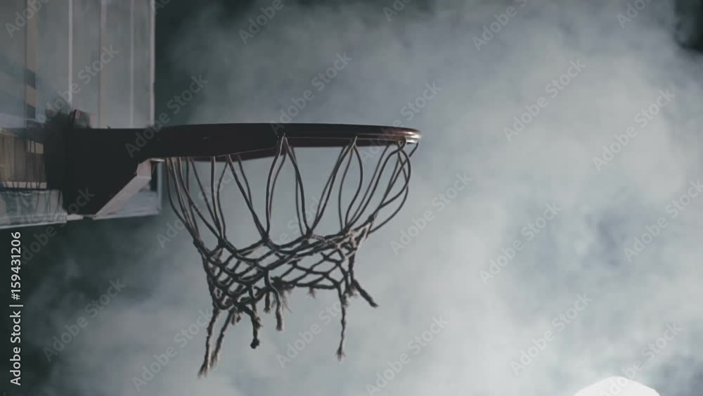 Basketball player throws the ball into the ring, slowmotion Basketball player throws the ball into the ring, slowmotion