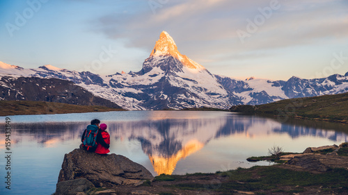 фотография Romantic couple at sunrise, from lake Stellisee, Swiss Alps , Matterhorn Peak, Z