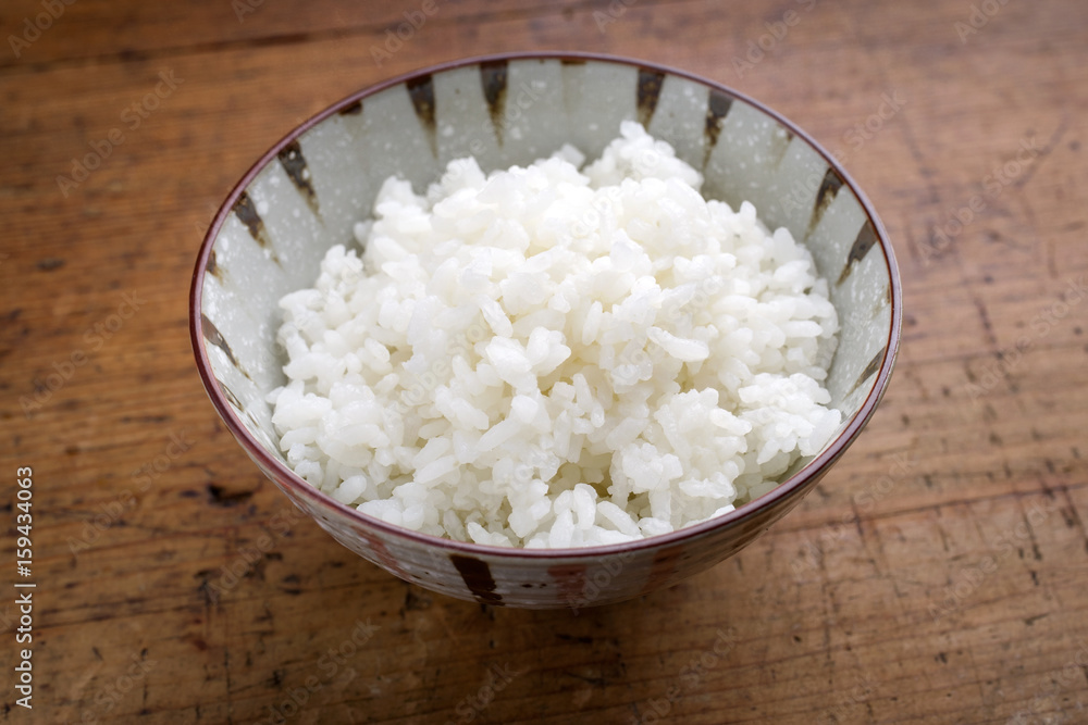 Traditional Japanese Koshihikari Rice as close-up in a bowl Traditional Japanese Koshihikari Rice as close-up in a bowl