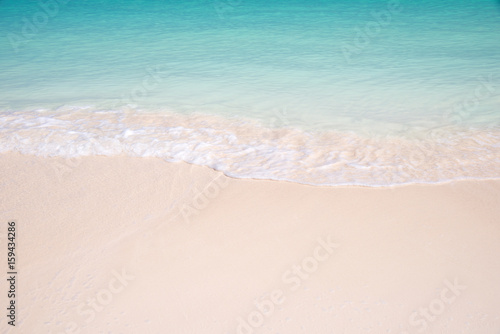 Sand and caribbean sea background, tropical beach travel concept