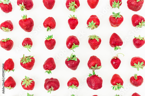Pattern of red strawberry on white background. Flat lay. Top view. Summer background