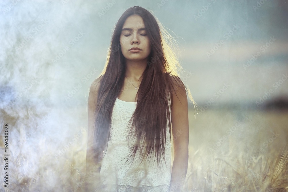 Young glamorous model posing in a field wheat Young glamorous model posing in a field wheat