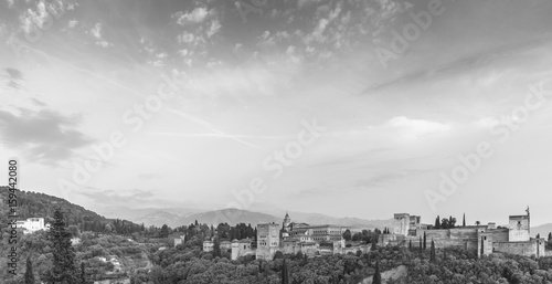 Black and white image of landscape of Alhambra of Granada, Spain, from Albaycin with Sierra Nevada's mountain on the background