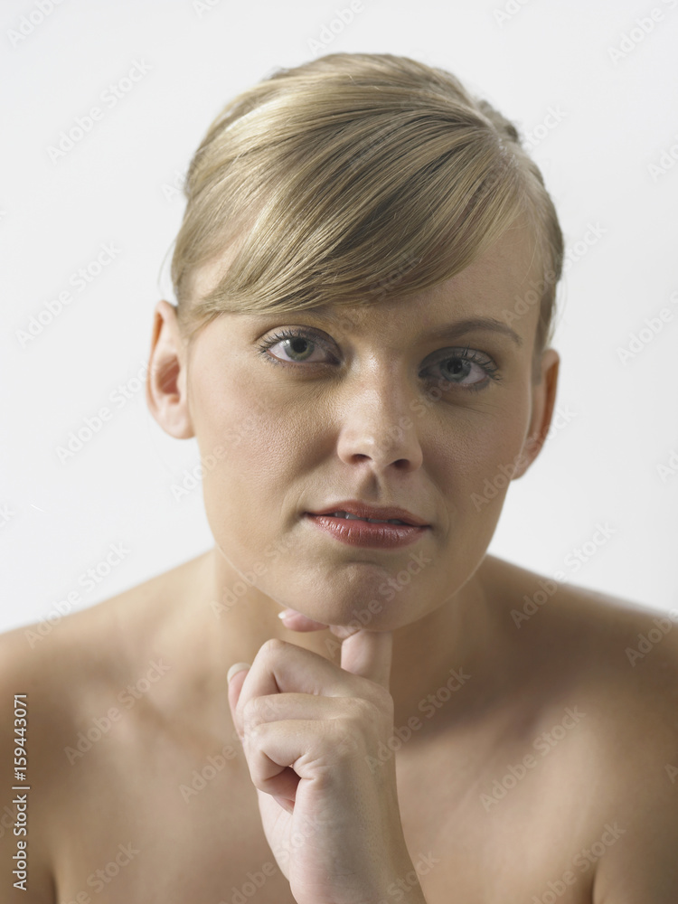 girl with hand on chin looking at camera girl with hand on chin looking at camera