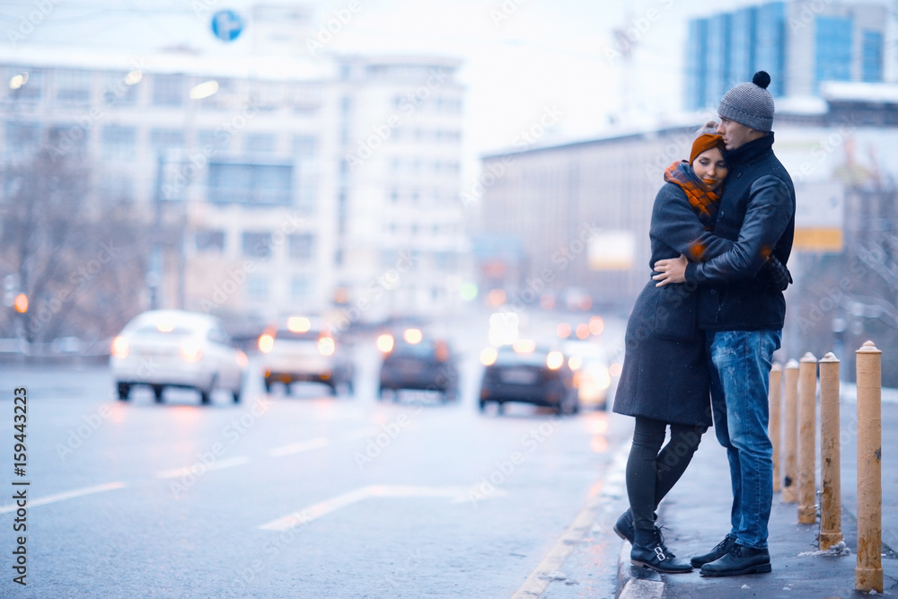 couple in city road snowfall