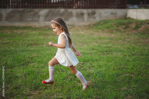 little beautiful running girl outside