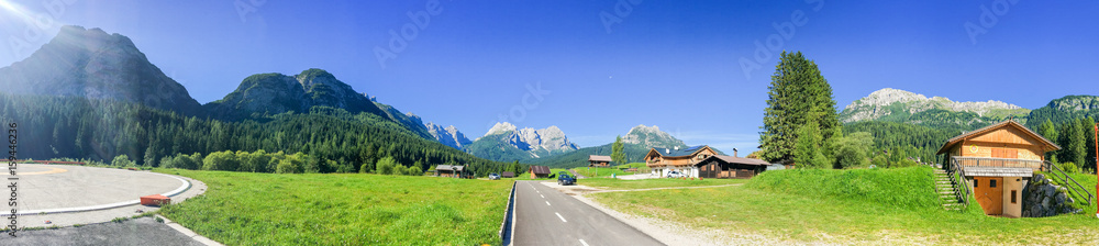 Huts surrounded by high mountains, italian alps Huts surrounded by high mountains, italian alps