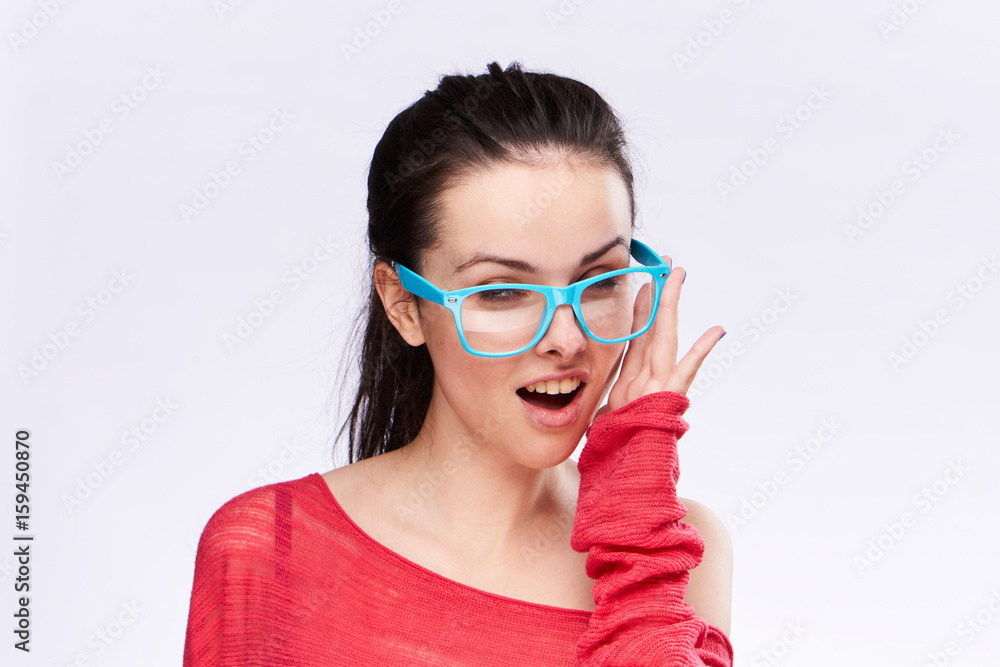 Woman in glasses on a light background