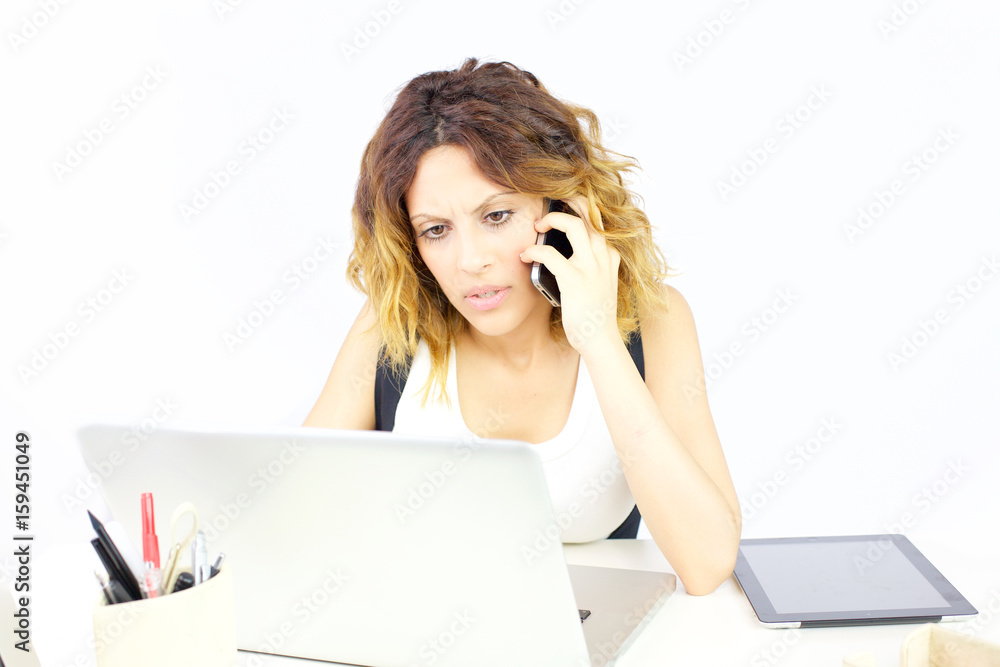 Worried business woman on the phone in office isolated Worried business woman on the phone in office isolated