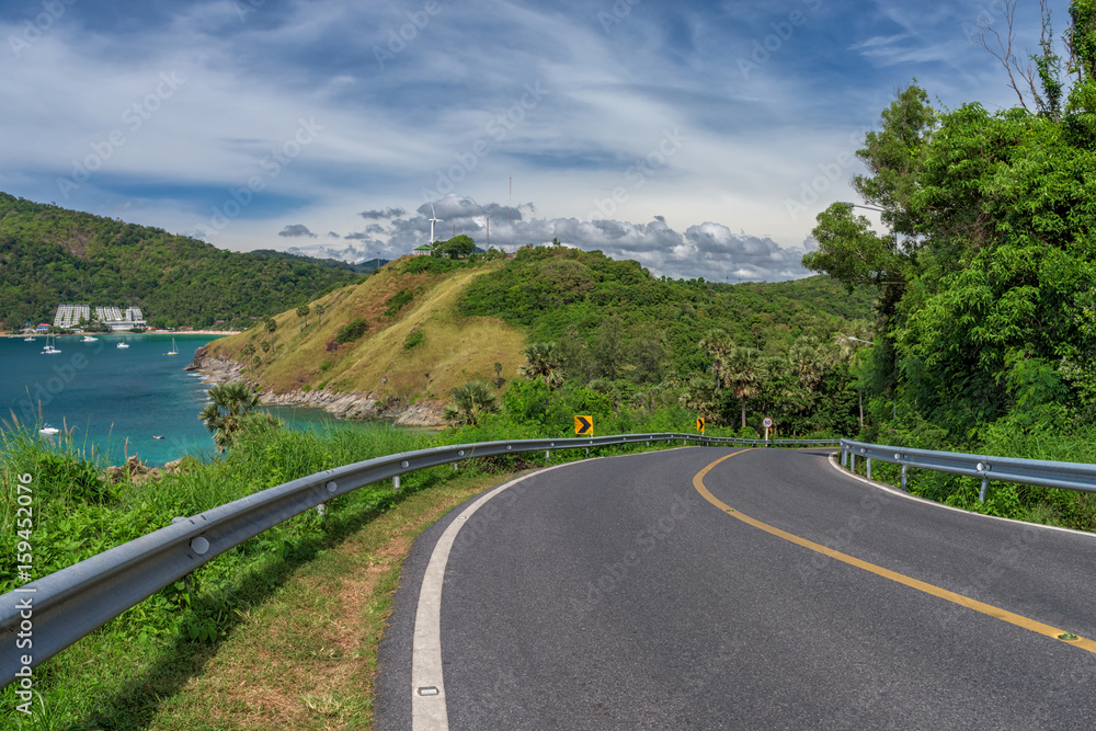 Asphalt road and sea in Phuket, Thailand.