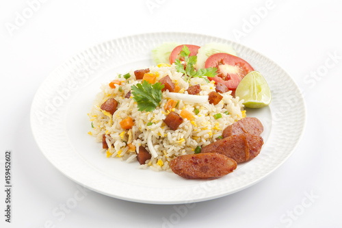 Fried rice with chinese sausage on white plate