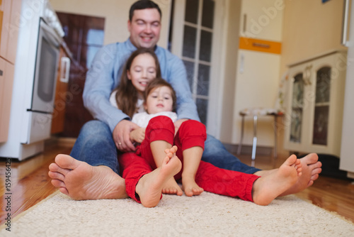 happy family at home on the floor © Aliaksei Lasevich