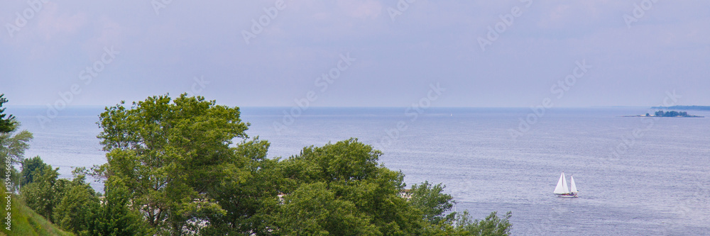 Beautiful summer landscape with sailing in the sea. Blue sky