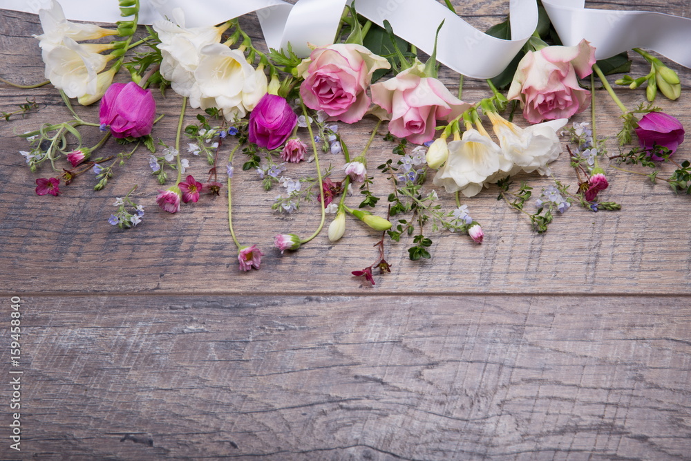 Festive flower composition on the old wooden background. Overhead view.