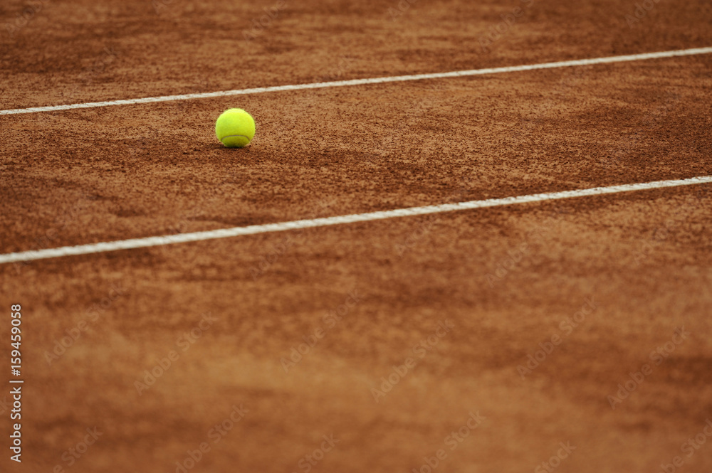Clay tennis court with ball