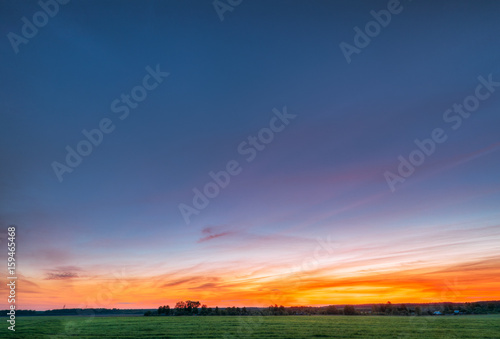Green Wheat In Spring Field Under Scenic Summer Colorful Sky At 